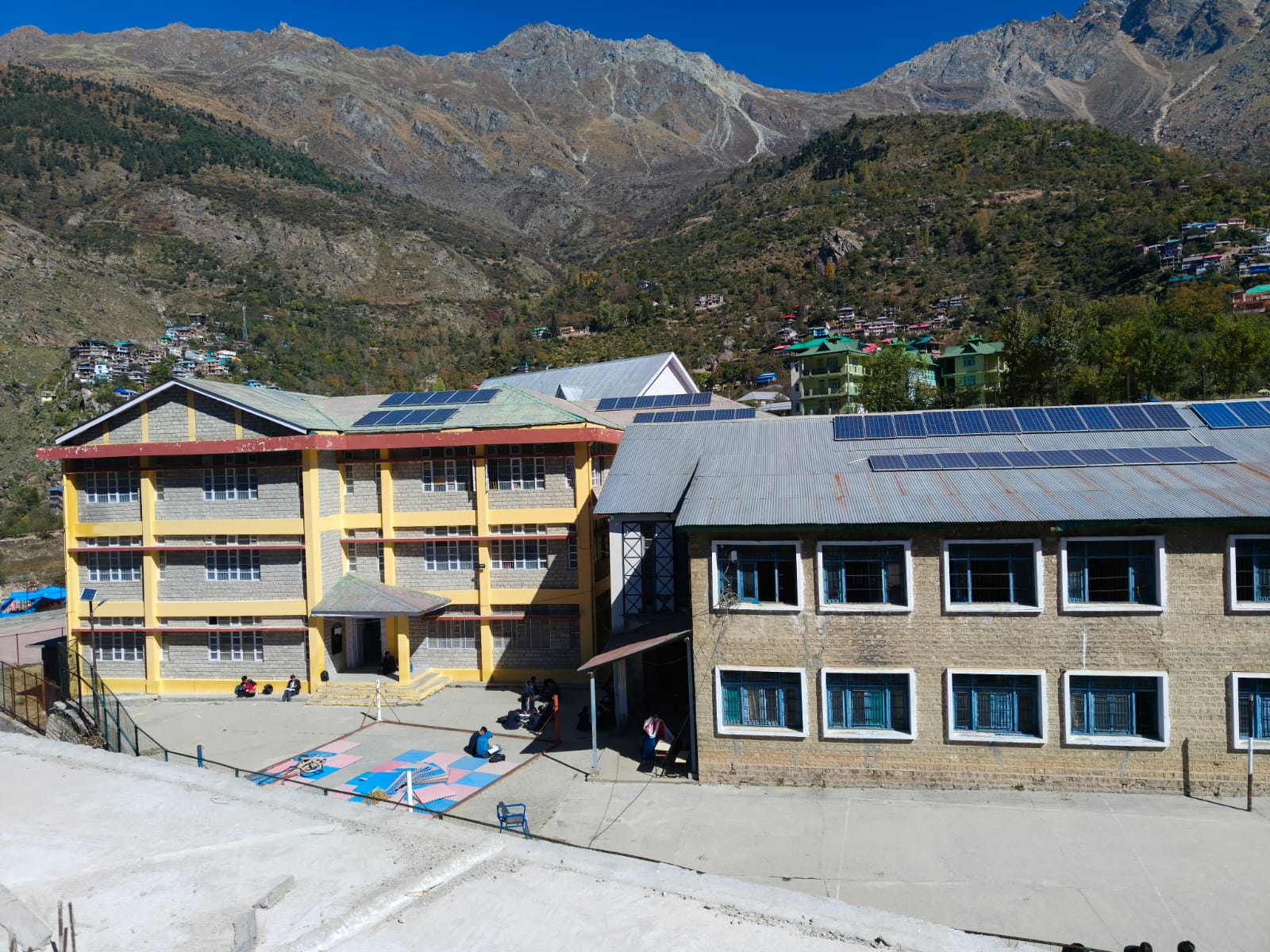 GSSS Sangla campus surrounded by Himalayan mountains